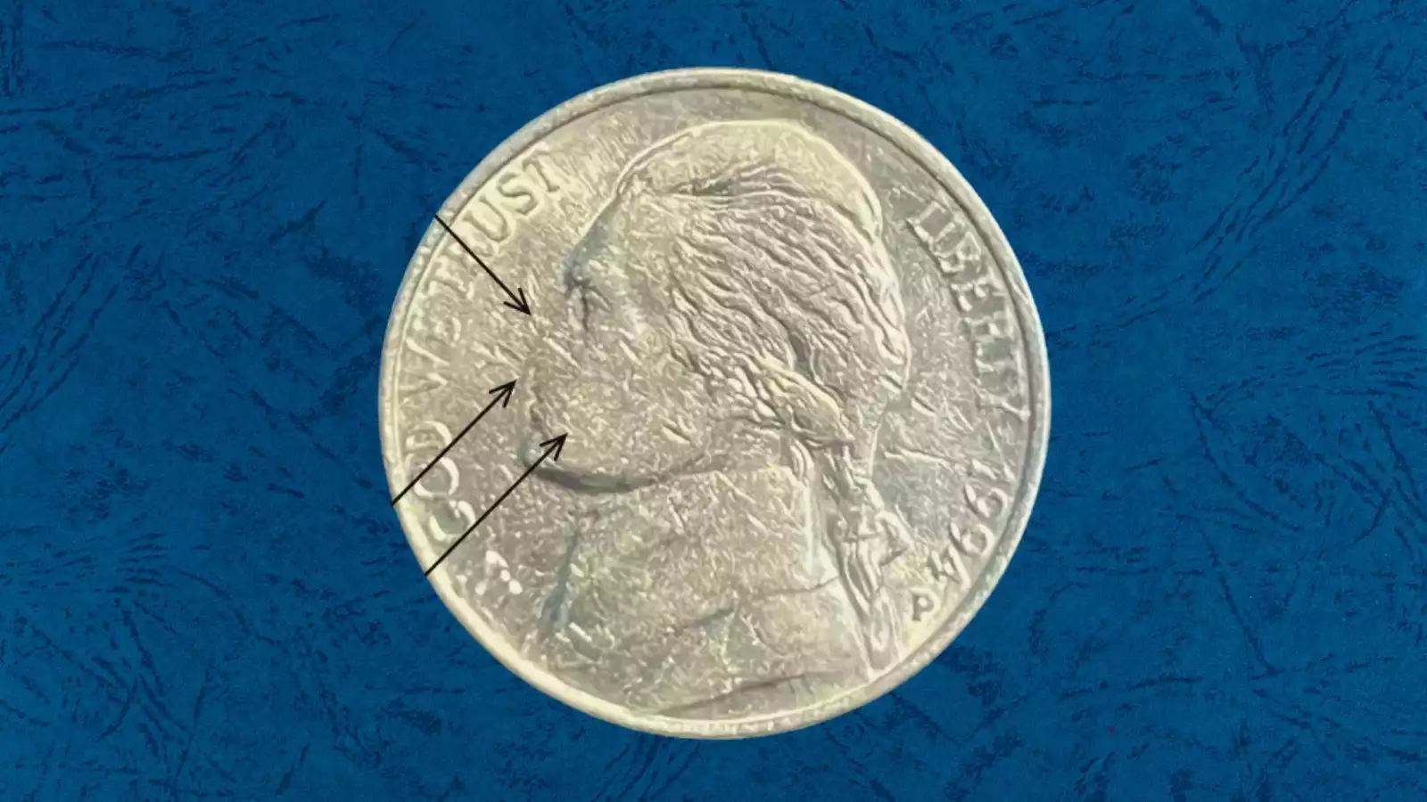 1994 nickel strike-through grease error showing weakened or missing design details on Jefferson portrait